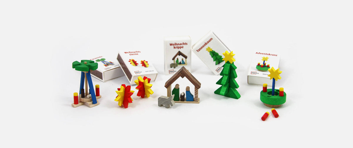 Wooden Christmas kits: nativity scene, pyramid, stars, Christmas tree and Advent wreath in a matchbox
