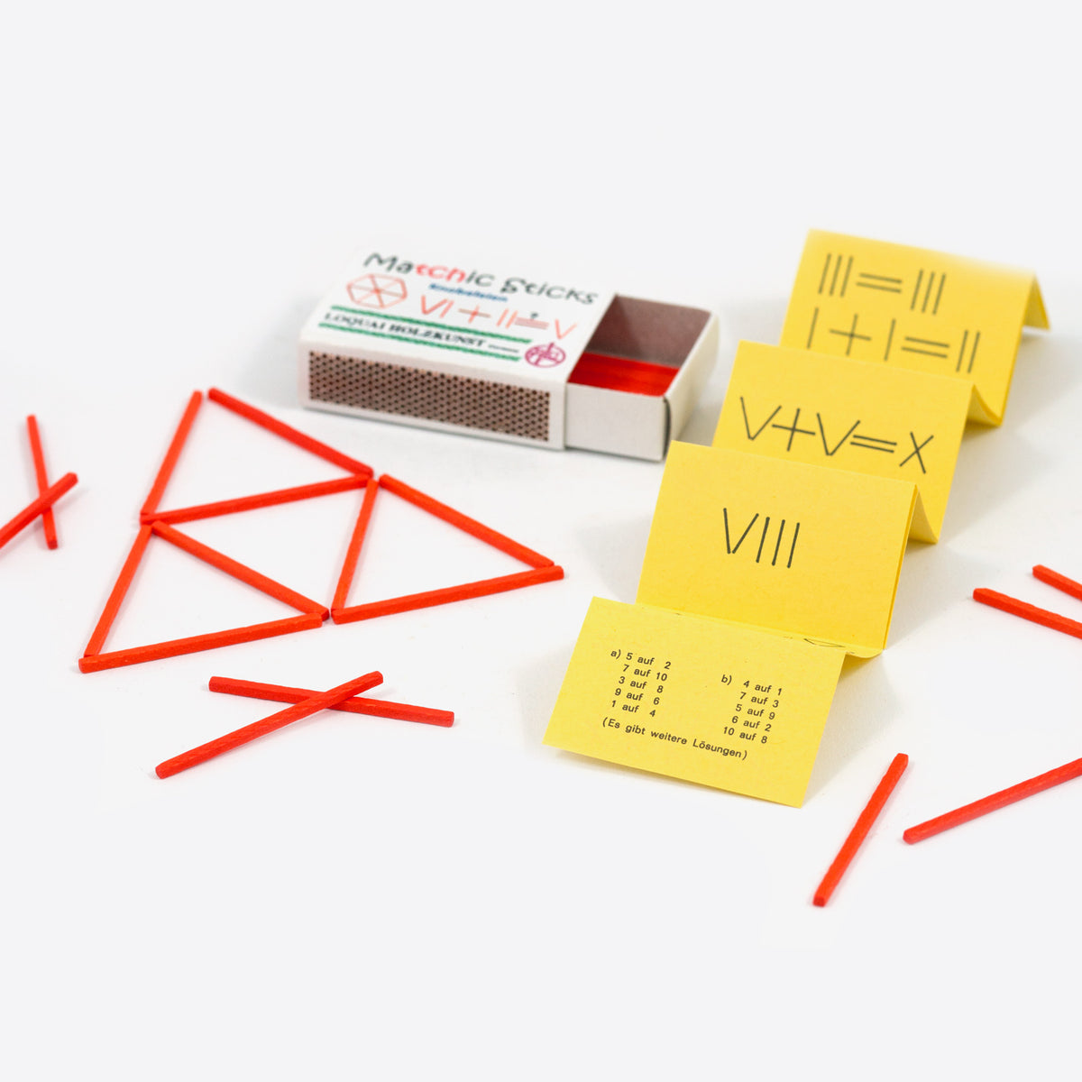Streichholzrätsel Matchic Sticks mit roten Holzstäbchen, gelben Aufgabenkarten und Streichholzschachtel